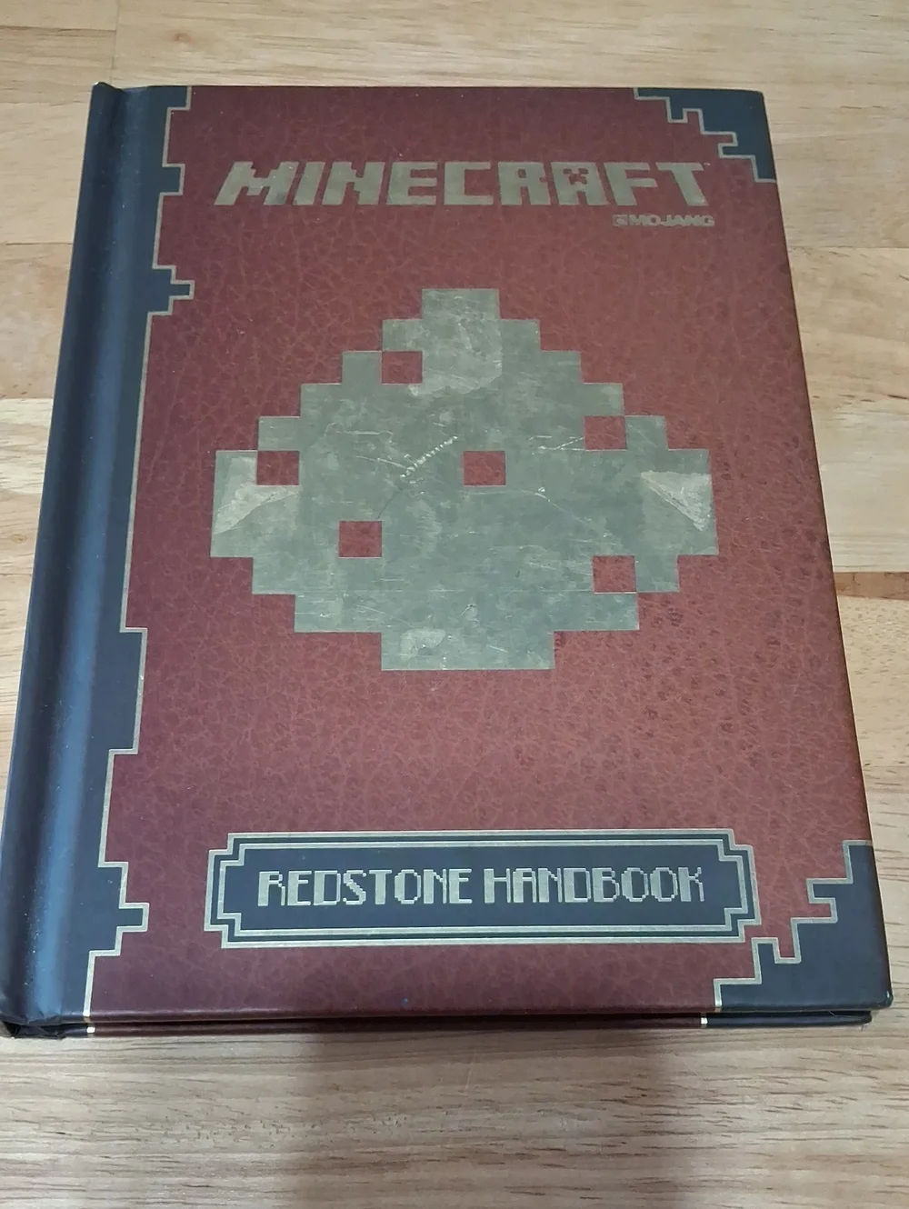 Minecraft Official Redstone Handbook - Brown and Gold Hardcover by Mojang
